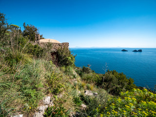 rural house on the Tyrrhenian sea and Li Galli islets in the background. Amalfi Coast, Campania, Italy