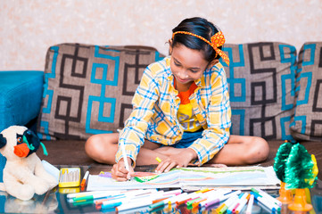 Happy little Cute little preschooler child drawing at home