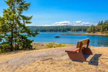 Fototapeta na wymiar A picnic bench with gorgeous view at mountain lake, British Columbia, Canada.