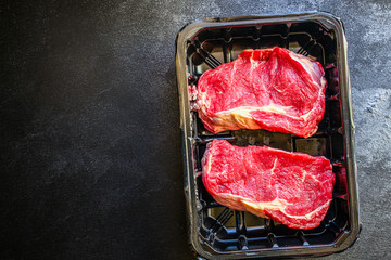 raw steak meat (beef or veal cooking) menu concept background. top view. copy spaces