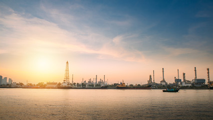Fototapeta premium Oil refinery or petrochemical industry with ship in thailand. for Logistic Import Export background.