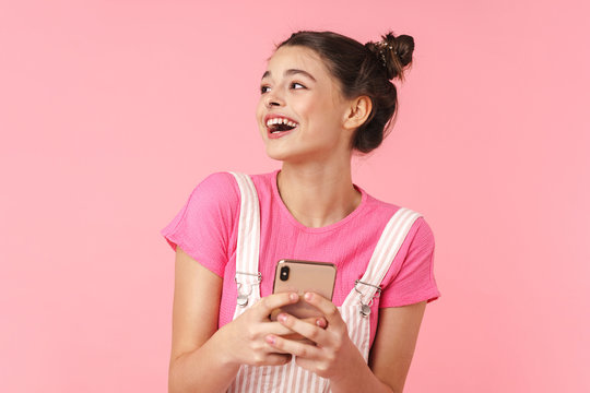 Photo Of Cheerful Nice Girl With Nose Ring Using Cellphone And Laughing