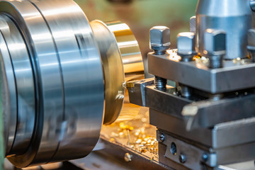 Bronze on a lathe, processing and manufacturing of parts from brass on a CNC machine.