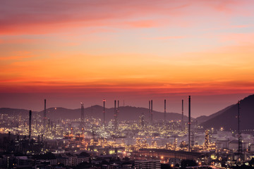 Fototapeta premium Aerial view oil refinery night background during twilight,Industrial zone,Energy power station.
