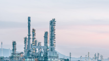 Fototapeta premium Aerial view oil refinery night background during twilight,Industrial zone,Energy power station.