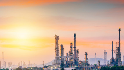 Fototapeta premium Aerial view oil refinery night background during twilight,Industrial zone,Energy power station.