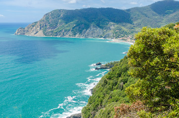 Majestic mountain ocean view from famous trail between Monterosso and Vernazza, Italy.