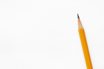 diagonal orange pencil isolated on white background, concept of back to school or note paper