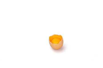 The raw yolk and white broken egg shell.