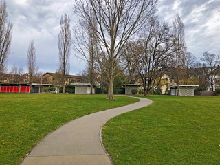 Park by the Tiefenbrunnen public bath on the Lake Zurich (Zürichsee, Zurichsee or Zuerichsee) -...