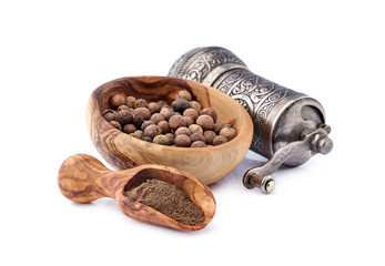 Pepper black  in wooden bowl on white background.