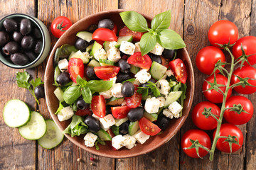 mixed salad with tomato, olive, feta cheese, basil and sauce
