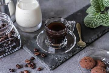 Photo of coffee with milk and homemade cookies. Espresso coffee. Dark background. Image.