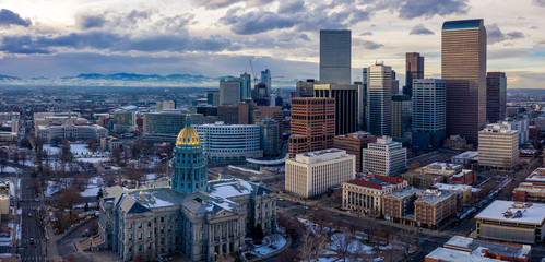 Colorado State Capitol Building & the City of Denver Colorado at Sunset.  Rocky Mountains on the Horizon