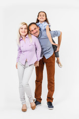 Fototapeta premium young happy family having fun on white background