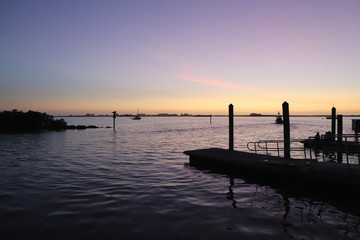 Fototapeta na wymiar Floating docks in marina at dusk