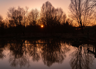 Beautiful sunset with reflections at Arnstorf, Bavaria, Germany