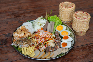 Thai favorite dish, Som Tam Thad,Papaya salad in tray,Have a seafood,salted egg,Cockle,crap,shrimp