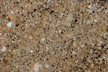 Background texture of conglomerate stone with many pores and holes
