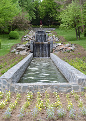 Vertical photo with the waterfalls of the fountain of Govora park, a very good place for relaxing with good energy and vibes.