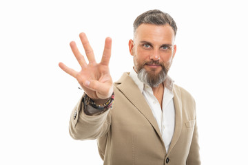 Portrait of handsome man wearing smart casual clothes showing four