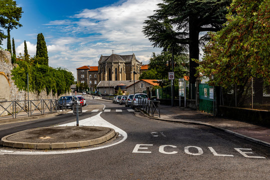 Inscription on the road ecole "school" in France.
