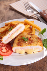 french fries and cordon bleu with salad