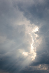 Sunbeam between storm clouds cloudscape sky