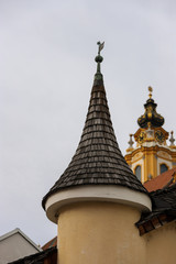 Small and pretty pointed tower with the tower of Melk Abbey behind.