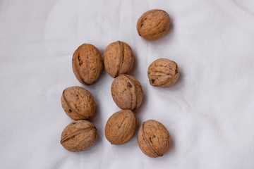  Walnut. A small pile of walnuts on a white background