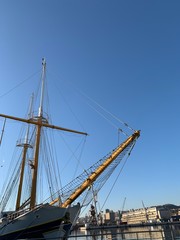 Fototapeta premium Wooden ship masts in the blue sky background