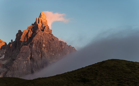 Cimon de la Pala wrapped by clouds during summer sunset, dolomites, Trentino Alto Adige, Italy, Europe