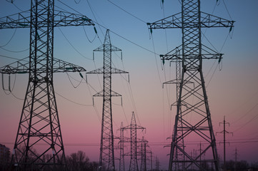 electricity pylons at sunset