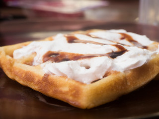 Obraz na płótnie Canvas Waffle with cream and caramel ready to eat