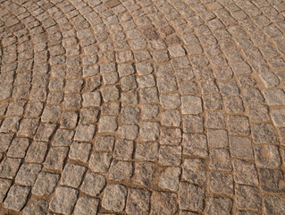 Old paving stones in perspective closeup, background, texture.