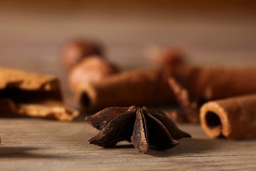 fragrant cinnamon sticks and star anise on a wooden surface
