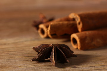 fragrant cinnamon sticks and star anise on a wooden surface