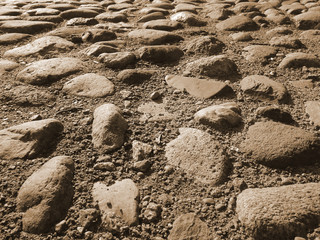 Old paving stones in perspective closeup, background, texture.