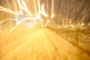 a Golden orange background smeared with a bridge stretching away into the distance in the...