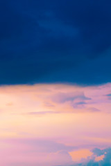 Dark stormy sky with the sun translucent