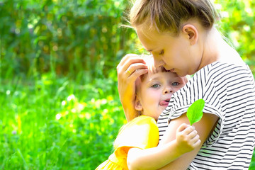 Happy mother and daughter outside