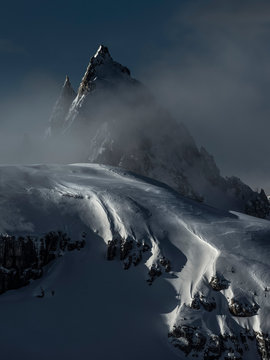 Detail of the Cadini di Misurina in winter during a cloudy dawn, Tre Cime natural park, dolomites, Auronzo, Veneto, Italy