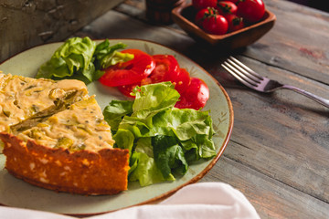 Homemade zucchini pie with salad