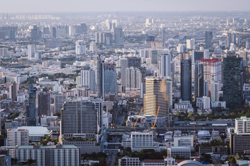 Fototapeta premium Vew of Bangkok skyline and skyscraper seen from Mahanakhon Tower Famous skyscrapers in day time