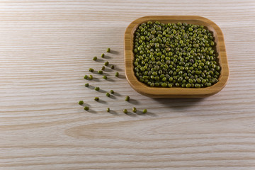 mung beans lying in a wooden plate