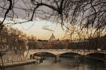 Beautiful sunset at Ponte Vittorio Emanuele II in Rome, Vatican. City scenery over Tiber river,...