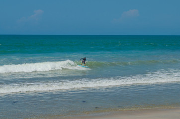 Surfing on beach in Kuta