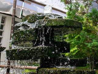 green nature and artificial water cascade