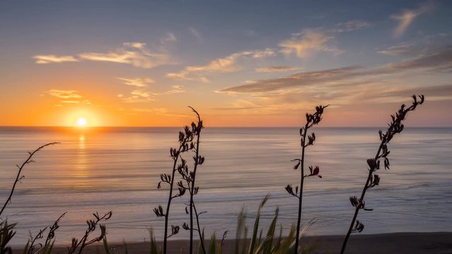 Timelapse of sunset at Ngarunui Beach, New Zealand