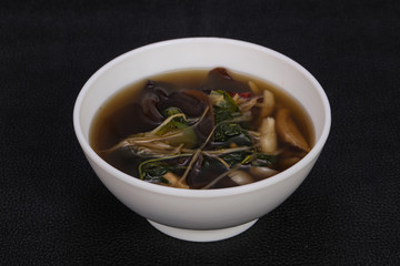 Thai style soup with meat and mushrooms